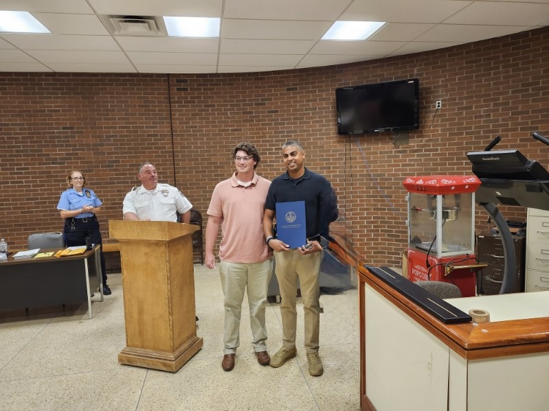 Philip Singh receiving a formal commendation